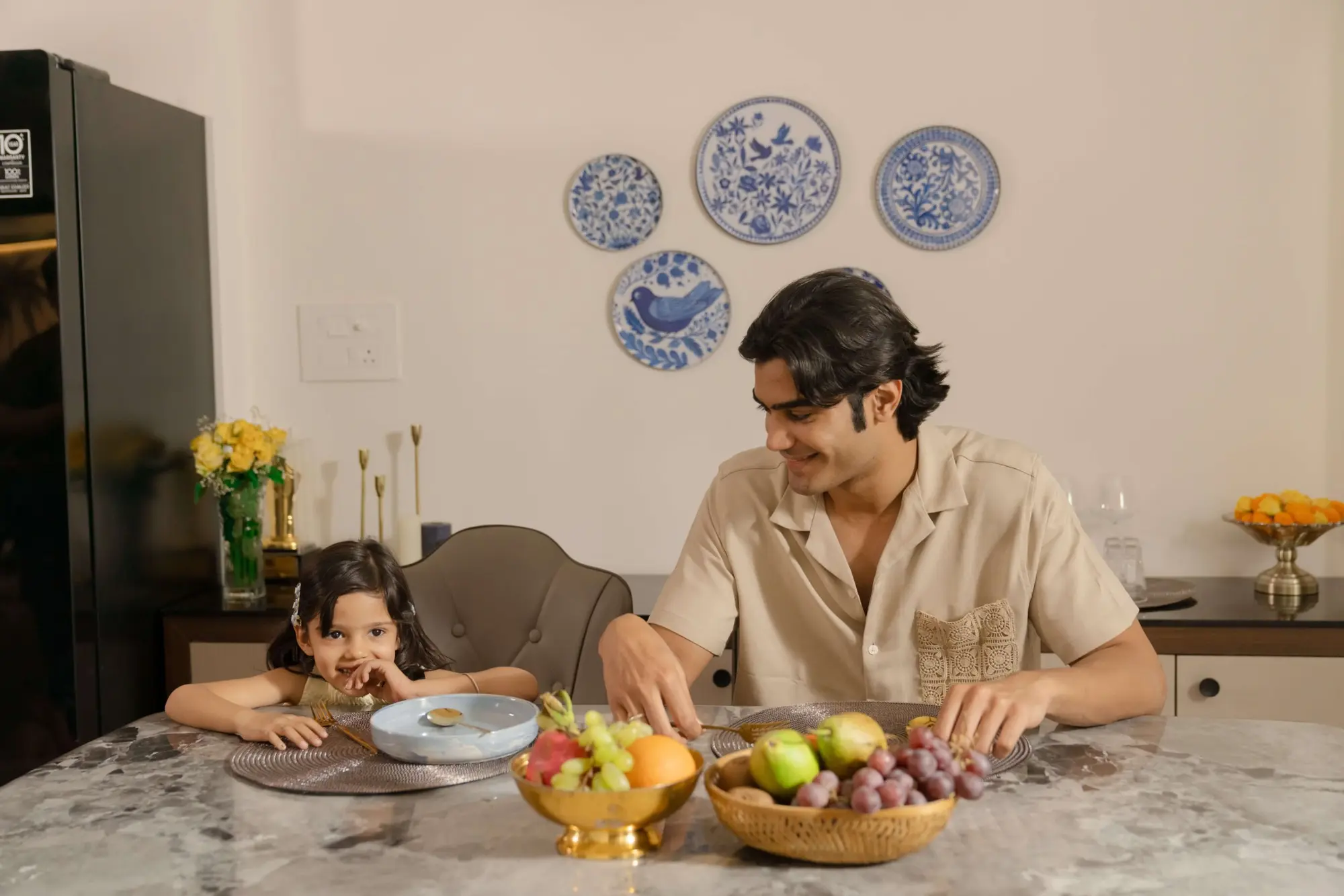 A father and daughter at the dining table