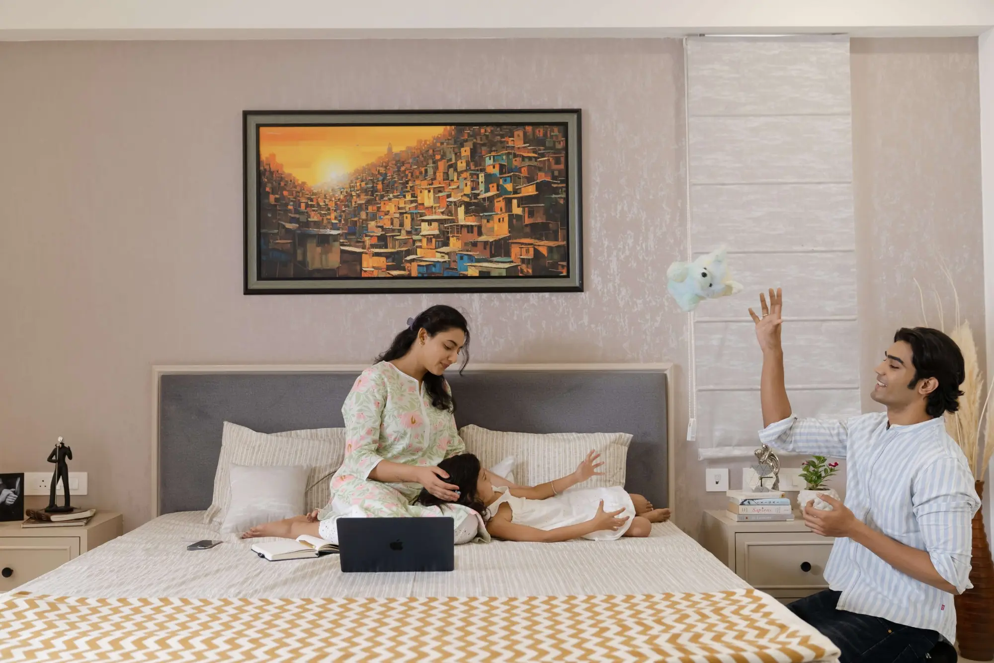 A mother and daughter relaxing in the bedroom